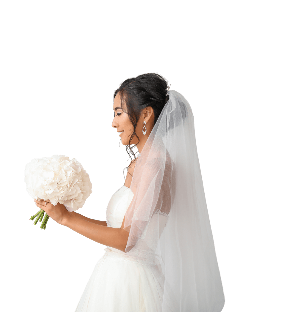 Bride looking at her flower bouquet